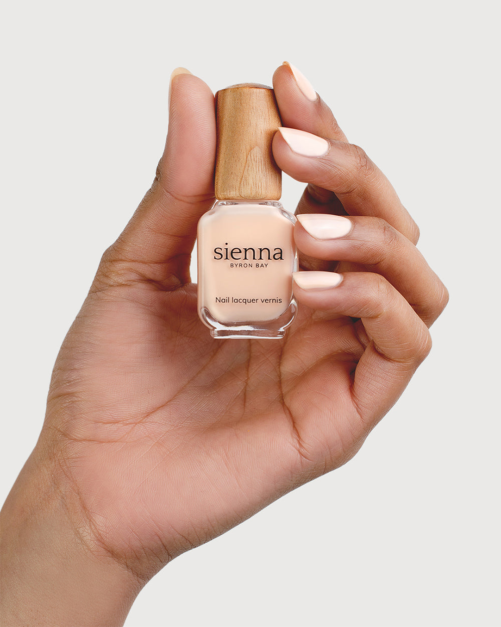 Nude Light Peach Nail Polish on Medium Skin Tone with Sienna Bottle