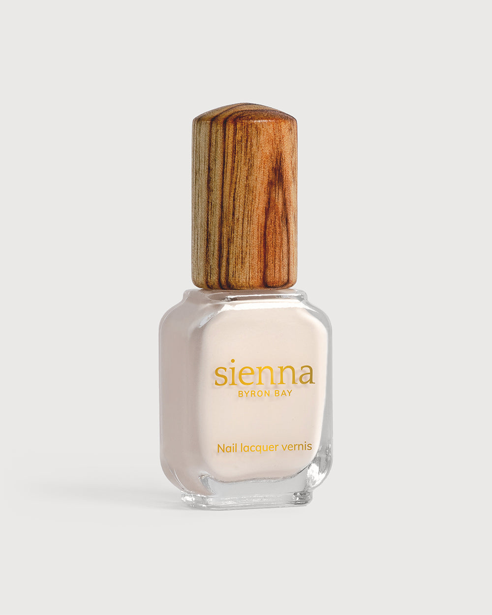 offwhite nail polish bottle with timber cap