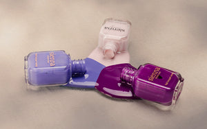 The Quiet Trio Gentle Midtone Blue Lilac Crème, Tranquility Light Mauve Rose Crème, nail polish bottles by Sienna Byron Bay.