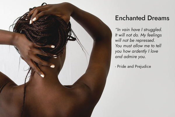 Dark skin tone woman with braids facing away wearing Luna eggshell white nail polish with Enchanted Dreams text and quote.