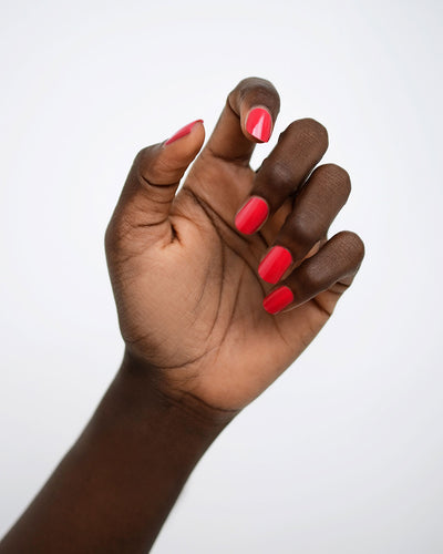 Bright Topaz Pink nail polish swatch on dark skin tone by Sienna Byron Bay