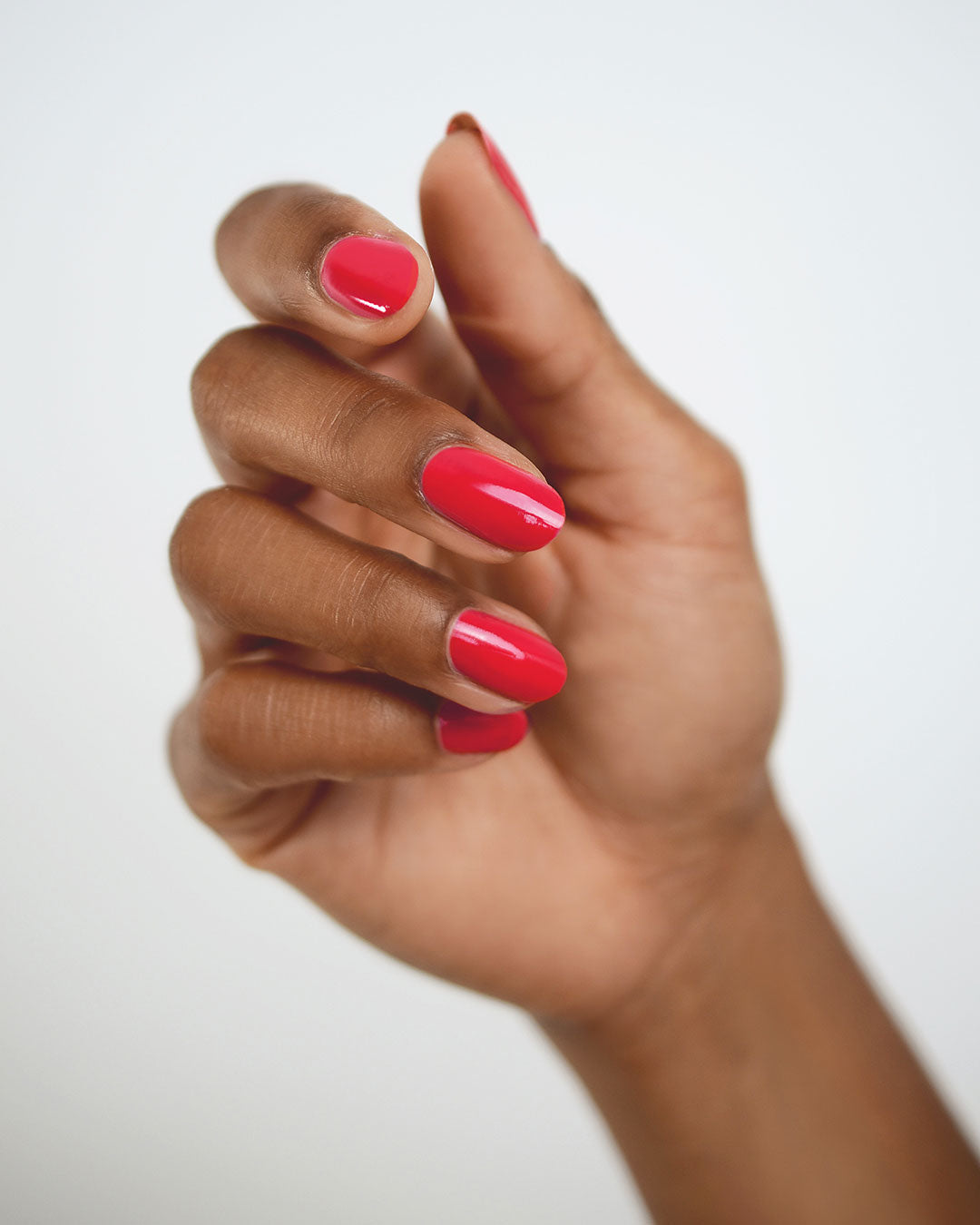 Bright Topaz Pink nail polish swatch on medium skin tone by Sienna Byron Bay