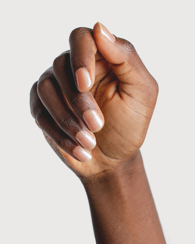 Grapefruit Granita Crystal nail polish on dark skin tone