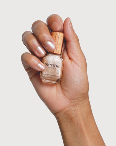 Grapefruit Granita Crystal nail polish on medium skin tone