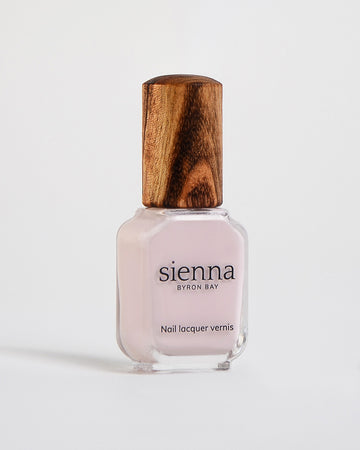 misty lilac nail polish in a bottle with a timber lid