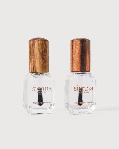 transparent base and top coat in glass bottle with timber cap