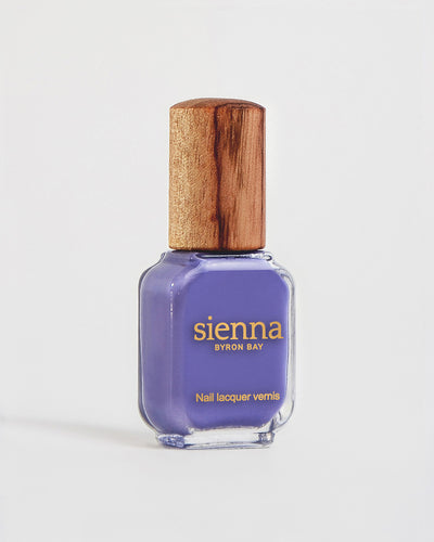 Gentle Midtone Blue Lilac Crème nail polish bottle with timber lid by Sienna Byron Bay.