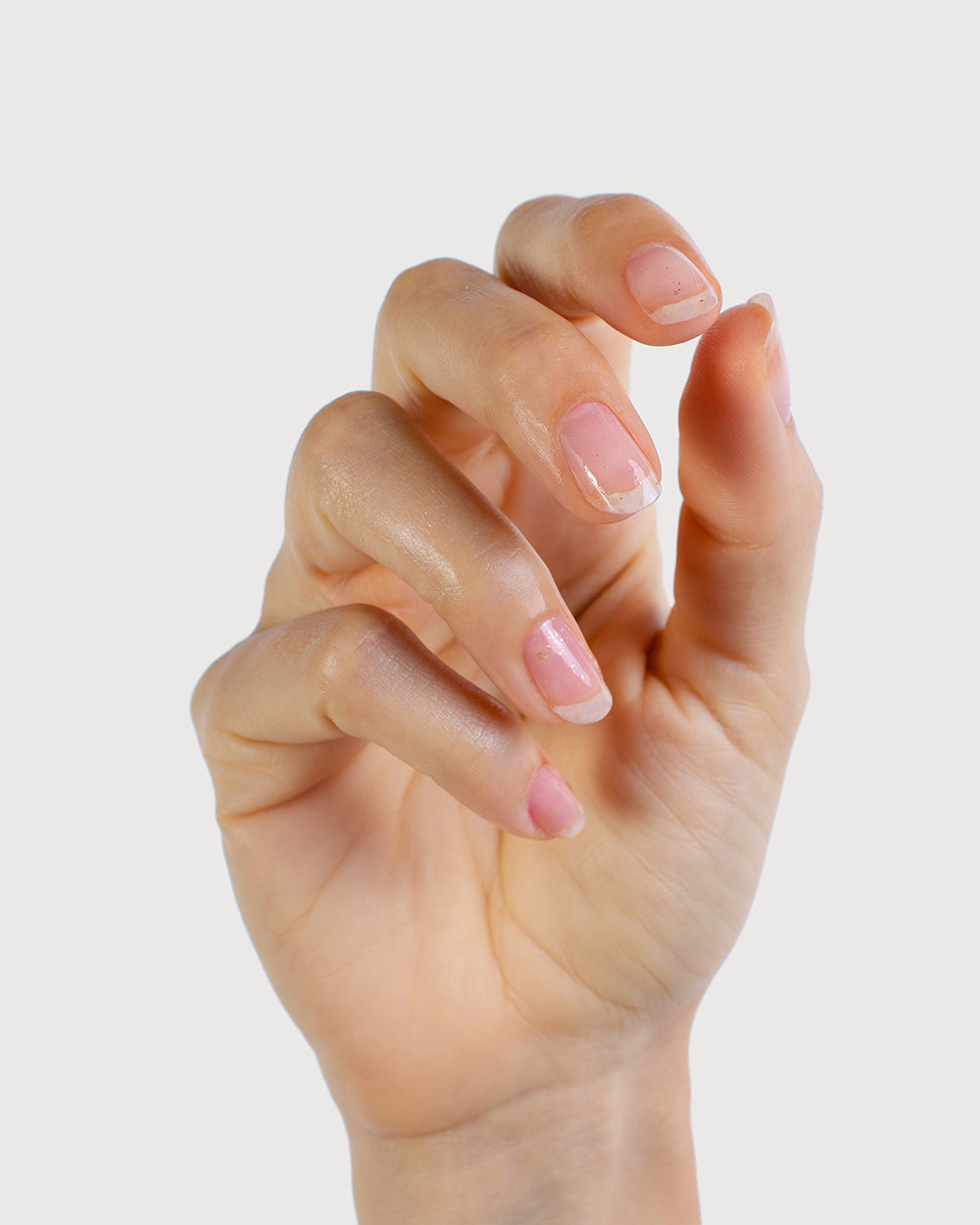 Golden Glow Cuticle Nectar on fingers