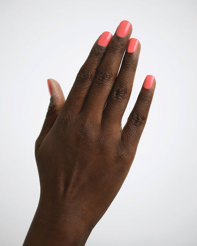 Grapefruit Pink nail polish swatch on dark skin tone by Sienna Byron Bay