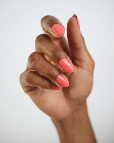 Grapefruit Pink nail polish swatch on medium skin tone by Sienna Byron Bay