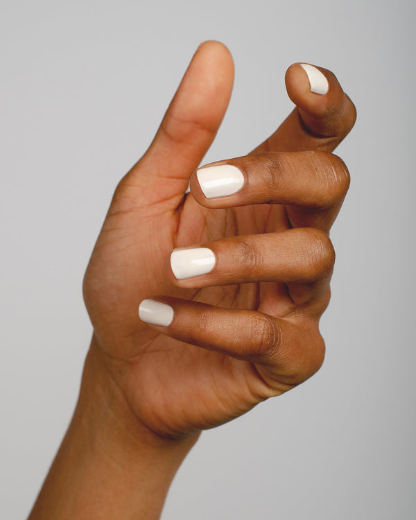 offwhite nail polish hand swatch on medium skin tone by sienna