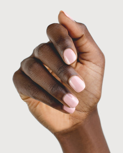 Shimmering Cherry Blossom Nail Polish on Dark Skin Tone with Sienna Bottle