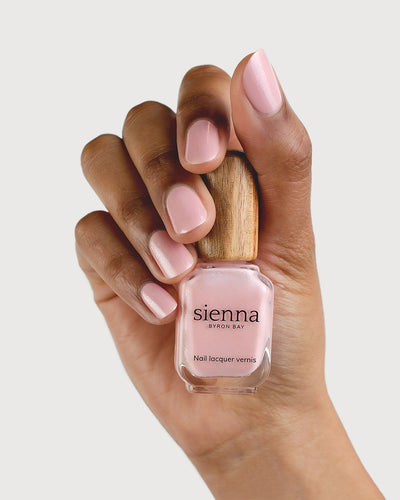 Shimmering Cherry Blossom Nail Polish on Medium Skin Tone with Sienna Bottle