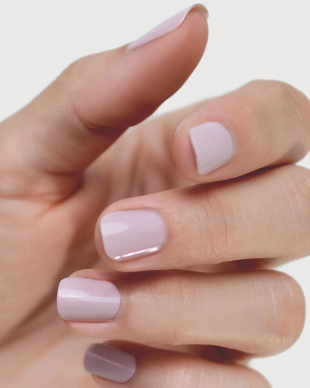 Tranquility Light Mauve Rose Crème nail polish by Sienna Byron Bay on fair skin tone hand.