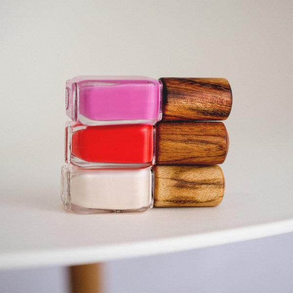 stack of 3 nail polish bottle with timber cap by sienna