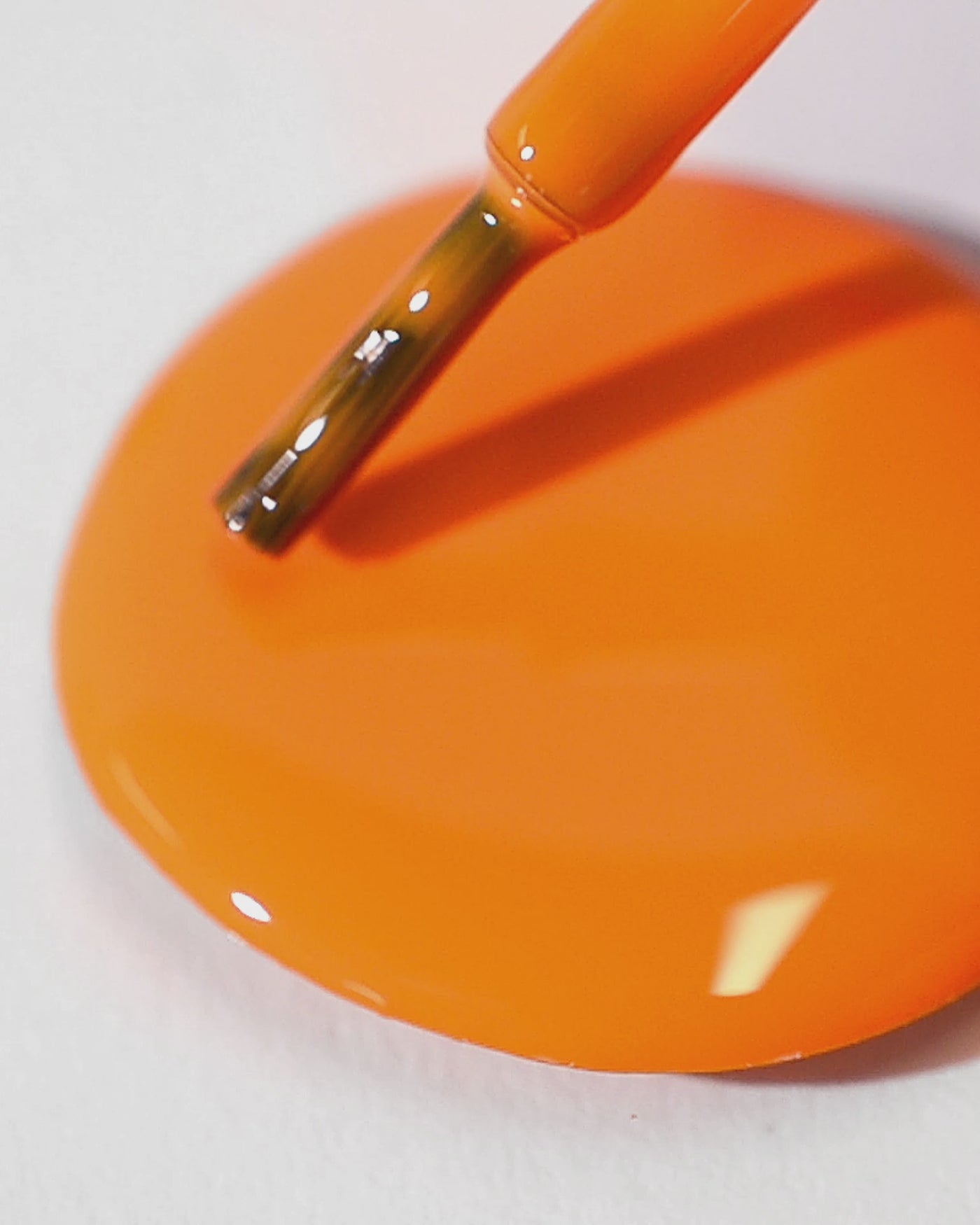 bright orange nail polish drop