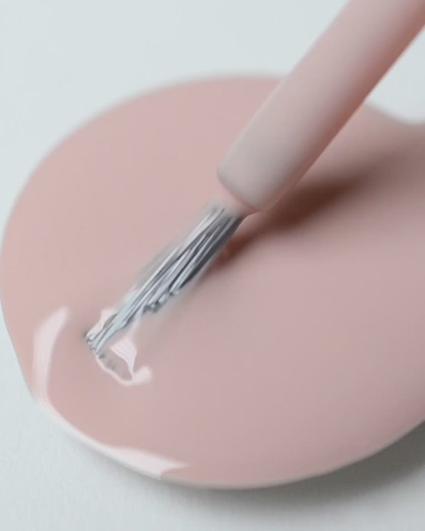 Soft neutral-pink nail polish swirl video