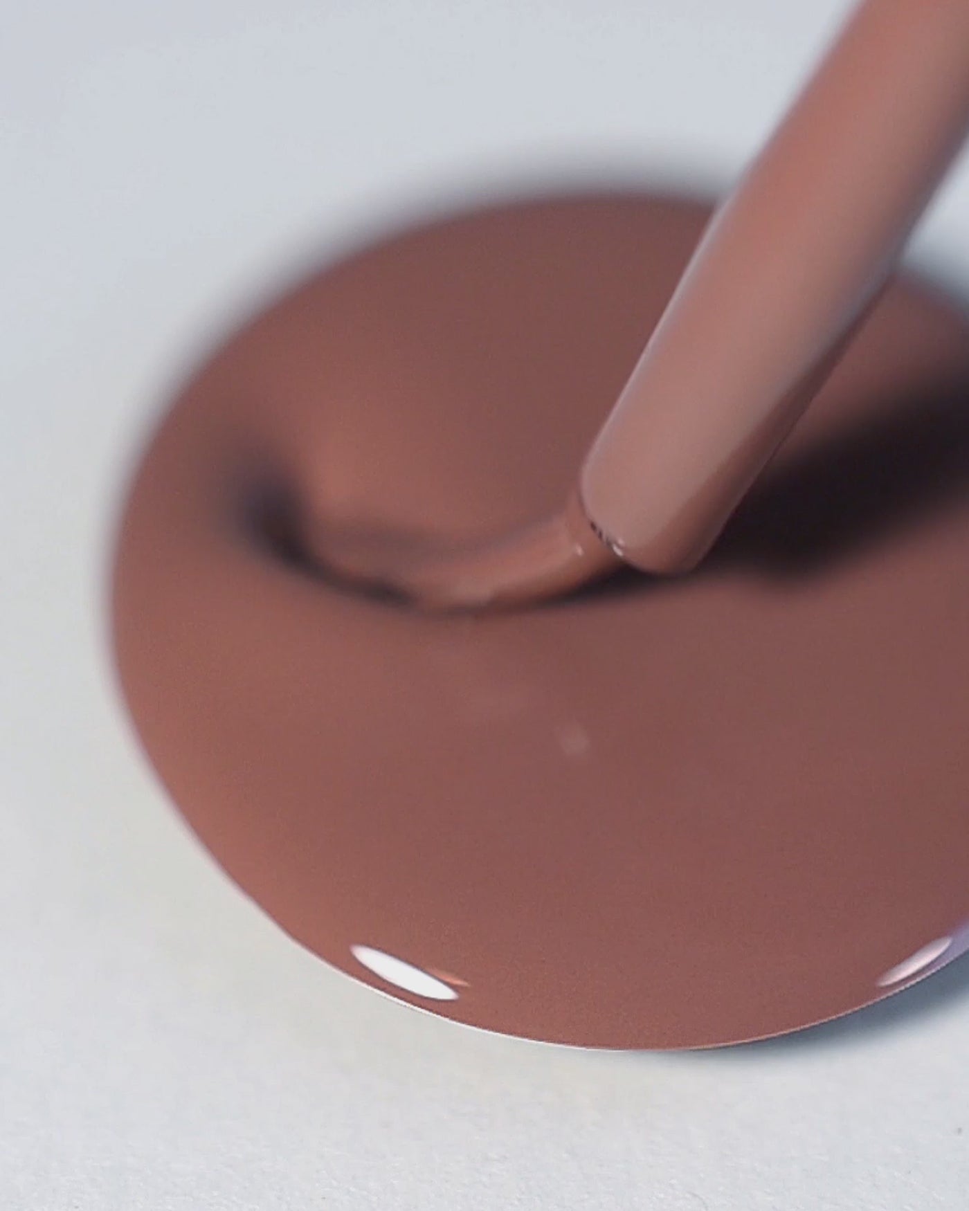 A nail polish swirl of Grounded mylk chocolate crème by Sienna Byron Bay close-up.