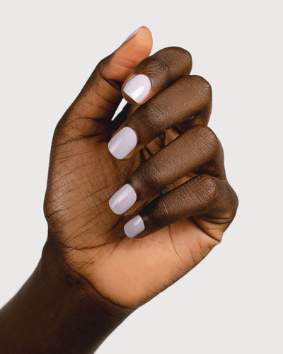 Thistle purple-grey nail polish hand swatch on dark skin tone