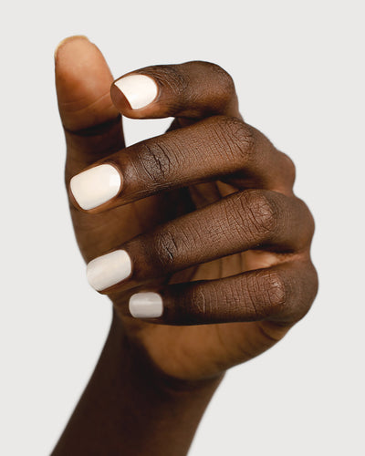 offwhite nail polish hand swatch on dark skin tone