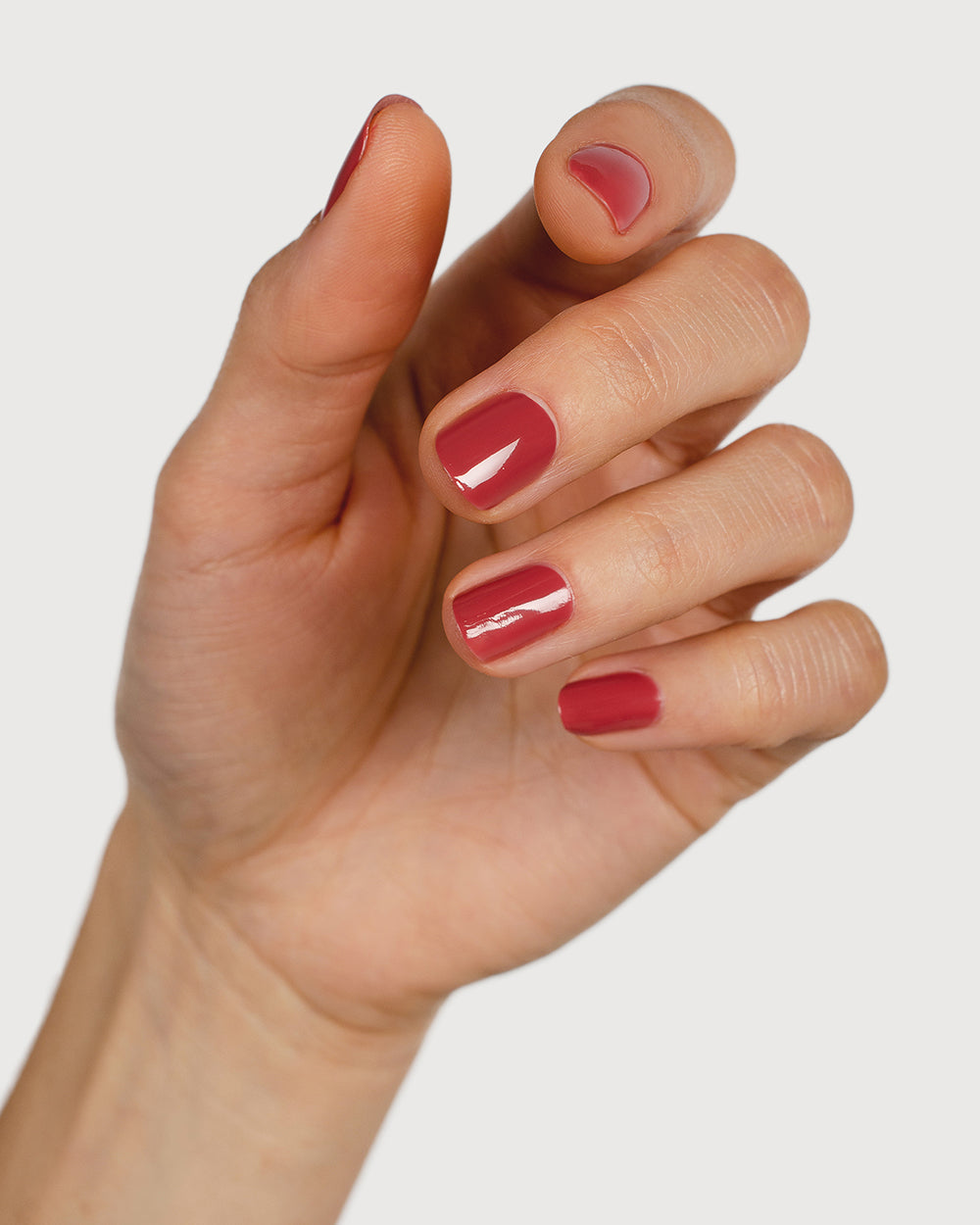 dusty rosebud nail polish hand swatch on fair skin tone