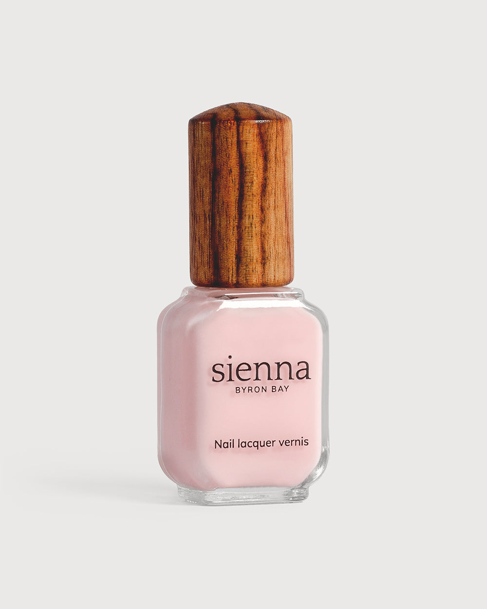 light rosewater pink sheer nail polish glass bottle with timber cap