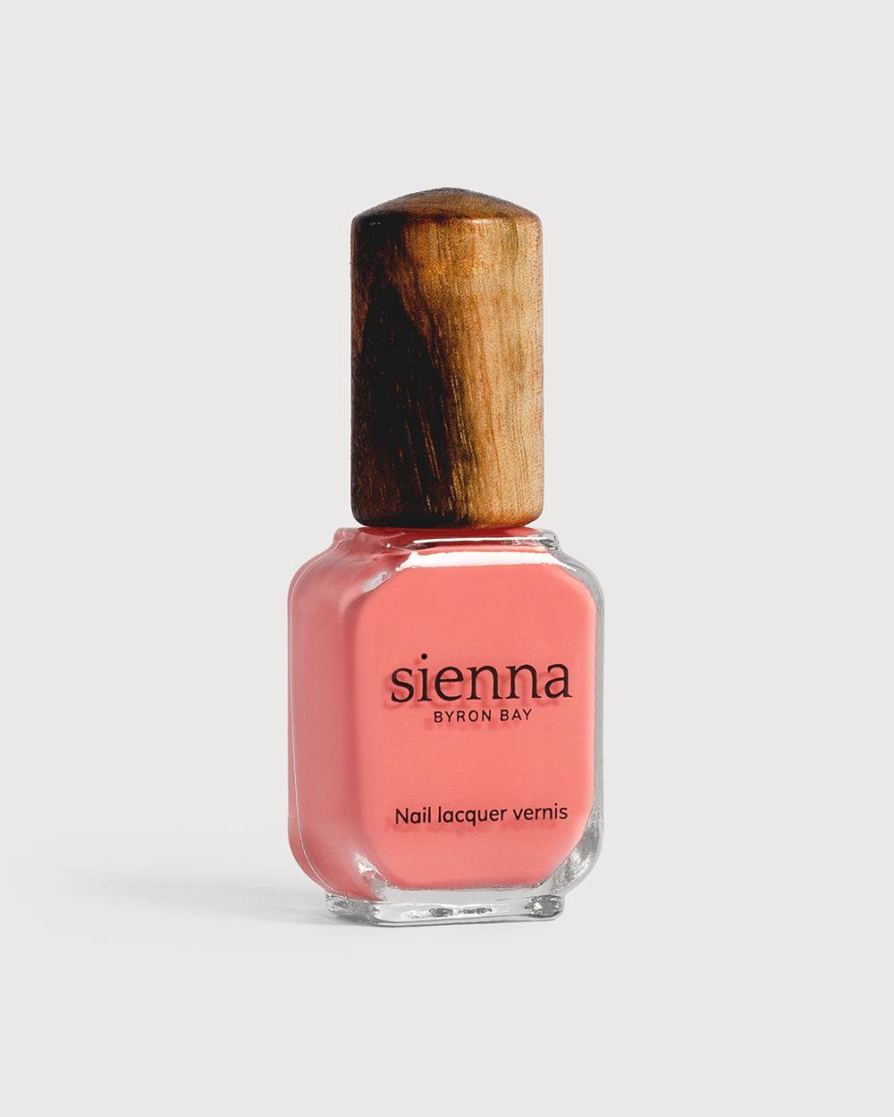 Pink peach nail polish glass bottle with timber cap