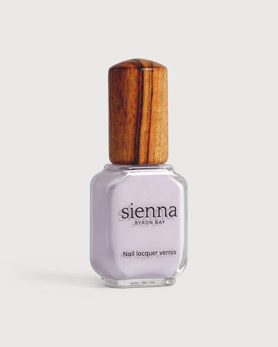 Light lilac pastel nail polish glass bottle with timber cap