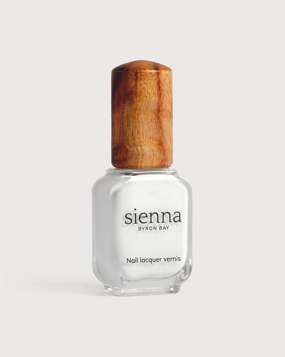 Crisp snow white nail polish glass bottle with timber cap